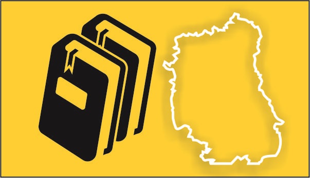 Żółty prostokąt z dwiema książkami obok obrys granic województwa lubelskiego